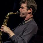 Photo of Tommaso Starch playing alto saxophone.