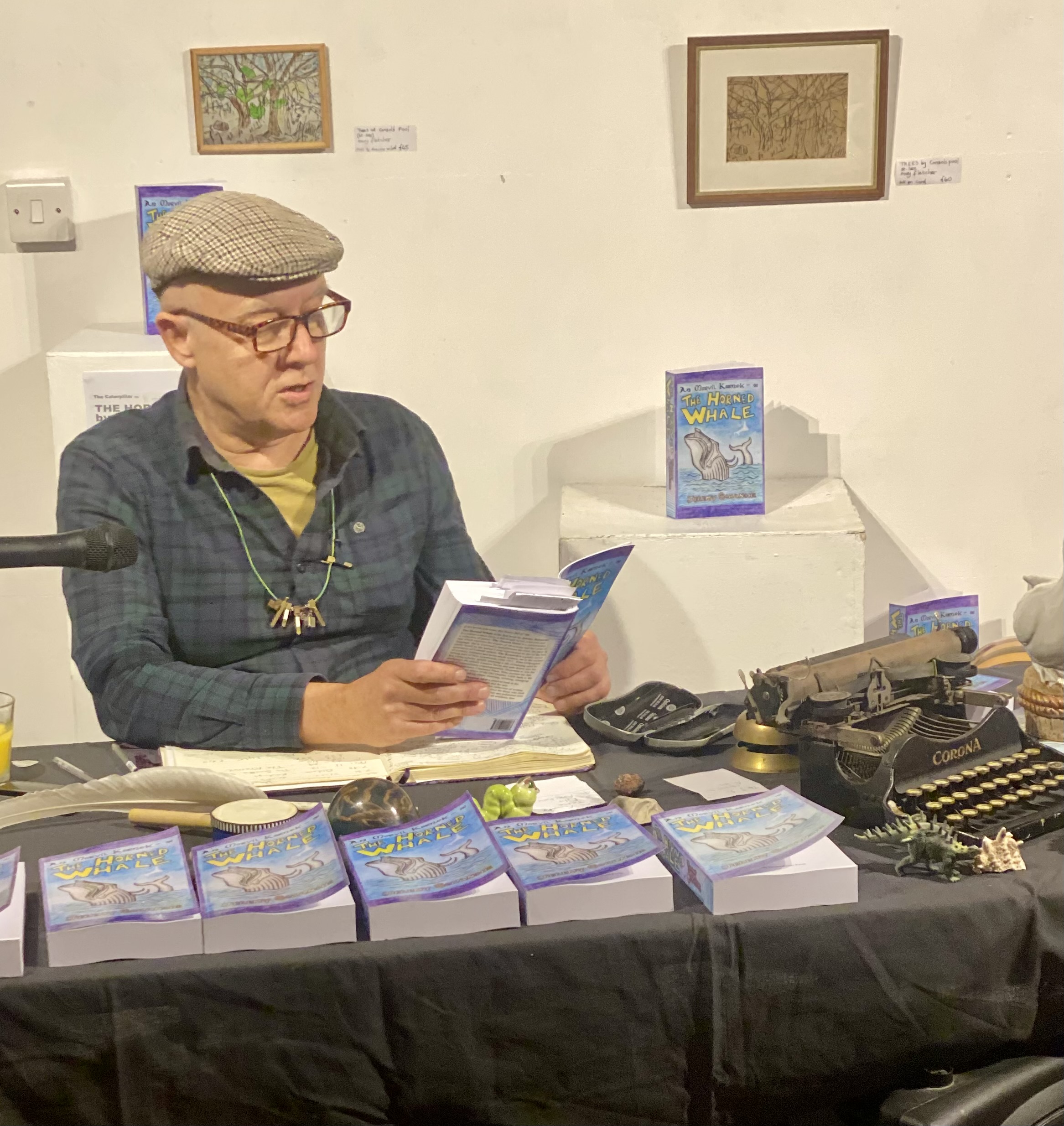 Photo of Jeremy Schanche reading from a book.
