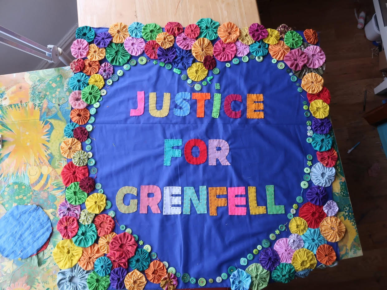 quilt with justice for grenfell lettering